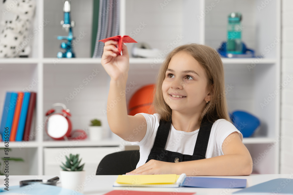 child smile and play with paper plane in school classroom child smile and play with paper plane in school classroom