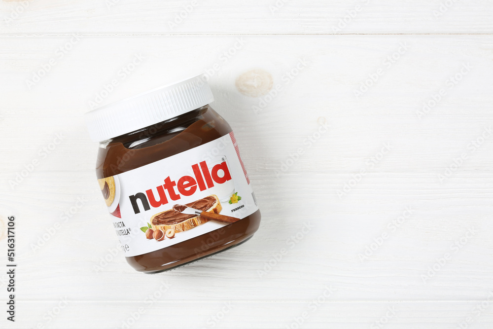 Nutella jar on white wooden background with copy space Stock Photo | Adobe  Stock