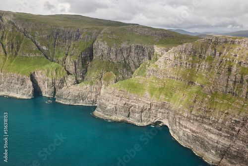 Faroe islands dramatic coastline viewed from helicopter. Vagar cliffs