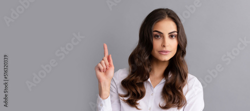 Trust your idea. Woman got idea. Career girl keep finger up. Eureka gesture. Woman isolated face portrait, banner header poster with mockup copyspace. © Olena