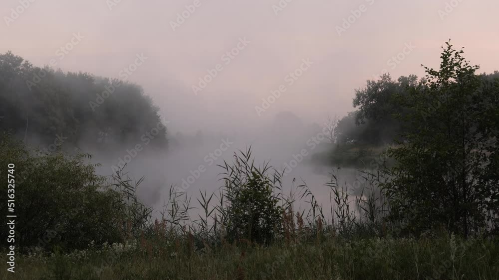 fog over the river at sunset a fisherman in a boat on the water 2022 fog over the river at sunset a fisherman in a boat on the water 2022