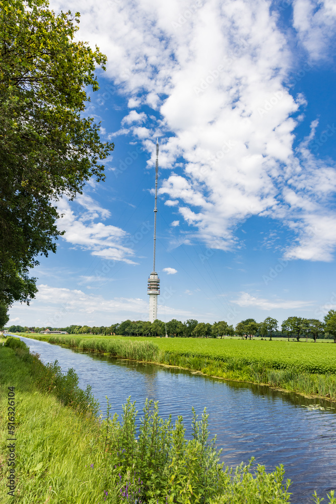 Obraz premium Landscape with Beilervaart and transmission tower Smilde in the backgroundThe Netherlands