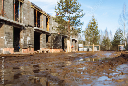 mud and slush on the construction site of designer private homes