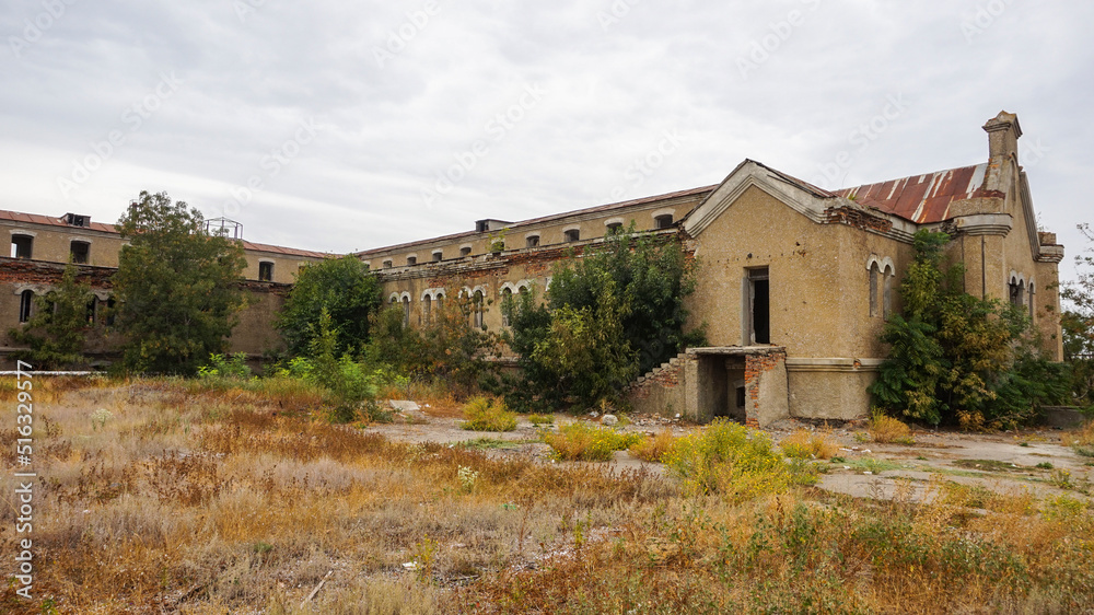 Historic abandoned building. Crumbling walls and broken windows. The old part of the Kuyalnik mud sanatorium