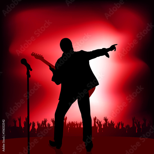 Concept of the rock music concert with a guitarist who greets his audience by pointing the finger at the crowd who applaud his show.