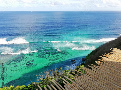 View of Indian Ocean, from the top of the hill at Unggasan village, in the southern part of Bali island during nice weather photo
