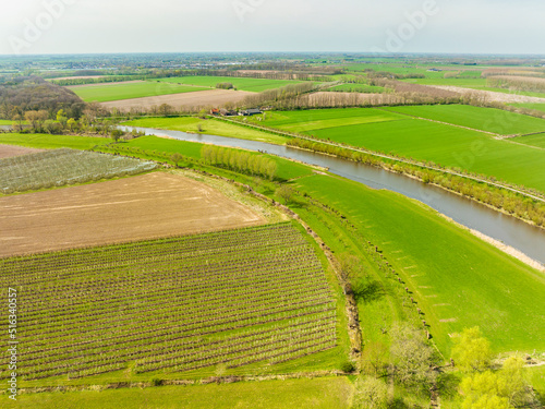 Aerial view of fruit orchards, farmland and river Linge, Betuwe, Gelderland, Netherlands. photo