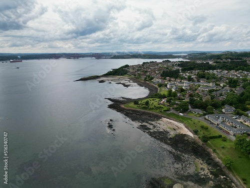 Aerial view of Dalgety bay coastal town surrounded by buildings and water