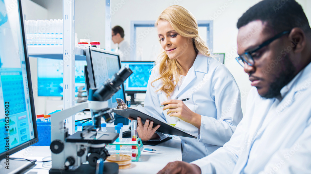Professional Doctors Doing Monkeypox Research in a Modern Futuristic Laboratory. Lab Experiments in Clinic Hospital. Science and Medicine Concept. Professional Doctors Doing Monkeypox Research in a Modern Futuristic Laboratory. Lab Experiments in Clinic Hospital. Science and Medicine Concept.