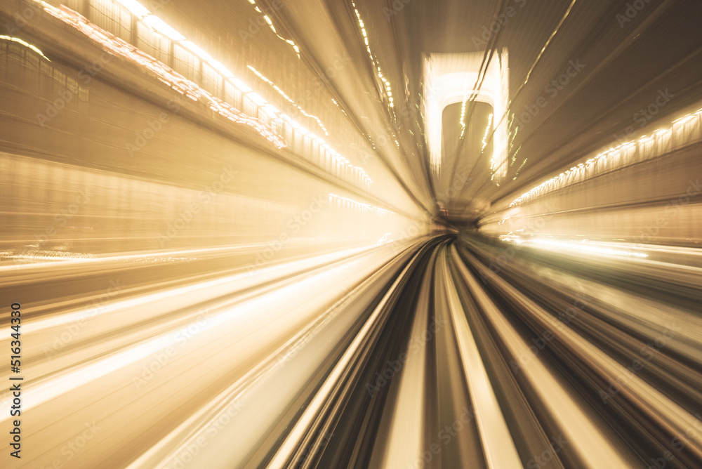 Motion blurred of train moving inside tunnel with daylight in tokyo, Japan. yollow color background concept Motion blurred of train moving inside tunnel with daylight in tokyo, Japan. yollow color background concept