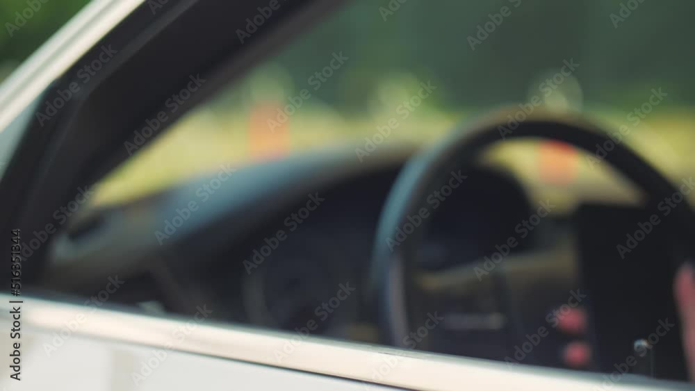 Happy business woman taking new car keys at vehicle. Joyful executive woman getting keys from new car.Close-up Happy business woman taking new car keys at vehicle. Joyful executive woman getting keys from new car.Close-up