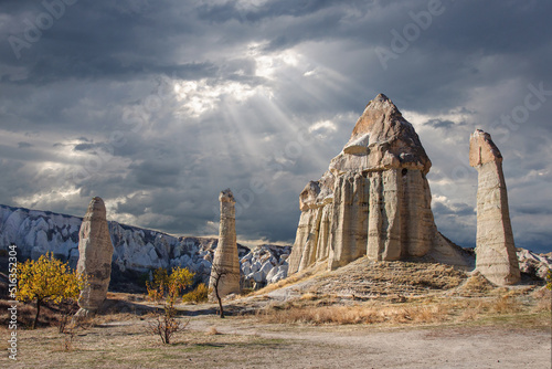 Cappadocia Turkey - stone pillars and cave houses at sunset