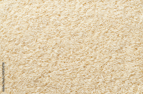 close-up texture of raw long rice basmati top view. photo