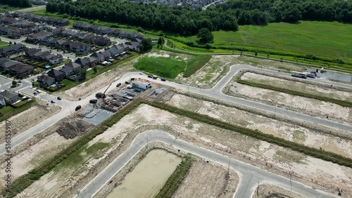 Aerial construction of standalone homes foundations in new subdivision