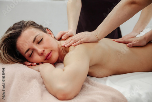 Massage in four hands in SPA salon