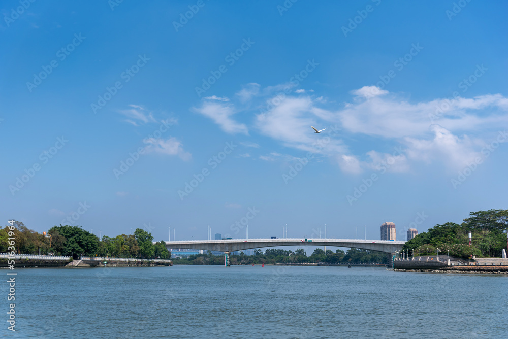 Daojiao Bridge on the east river in DongGuan in china. Landscape of blue sky and clear river in summer.