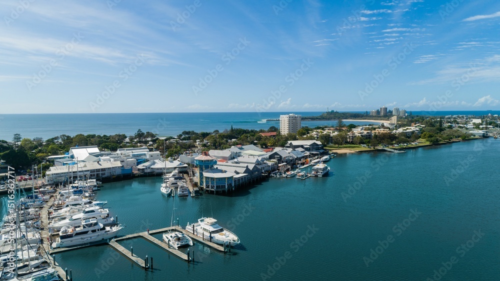 Fototapeta premium Aerial view of a wharf in a beautiful ocean in Mooloolaba, Queensland, Australia