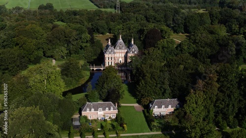 A dynamic horizontal aerial footage of the Castle Duivenvoorde in the town of Voorschoten, South Holland, in the Netherlands. It was originally a 13th-century residential tower surrounded by a moat. photo