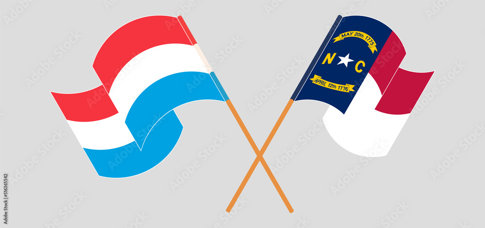 Crossed and waving flags of Luxembourg and The State of North Carolina Crossed and waving flags of Luxembourg and The State of North Carolina