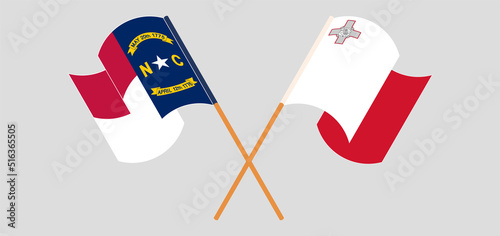 Crossed and waving flags of The State of North Carolina and Malta