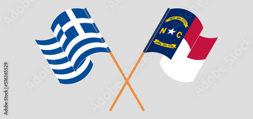 Crossed and waving flags of Greece and The State of North Carolina