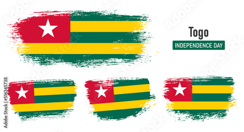 Textured collection national flag of Togo on painted brush stroke effect with white background