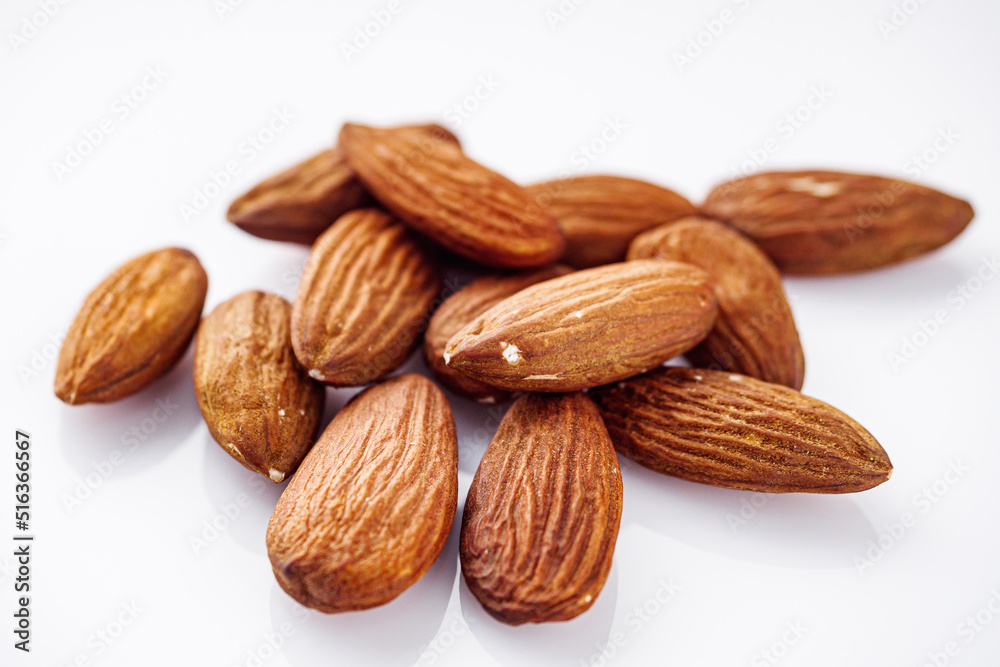 fresh almonds in shell on a white background fresh almonds in shell on a white background