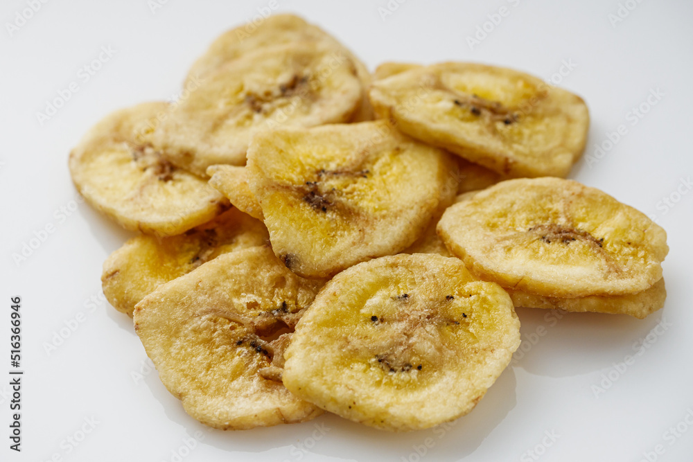 delicious dried banana on a white acrylic background delicious dried banana on a white acrylic background