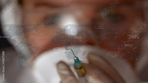 Animation of world map with data processing over caucasian female scientist holding syringe photo