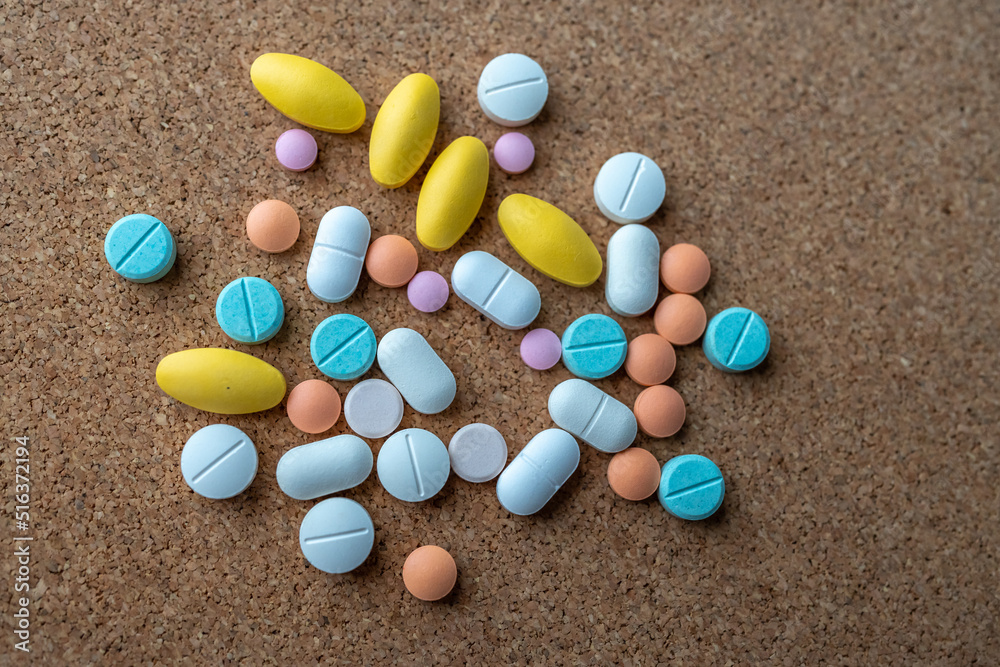 Pharmaceutical medicine pills in both tablets and capsules with the vintage retro picture style. Pharmacy theme and treatment medication as concept. Pharmaceutical medicine pills in both tablets and capsules with the vintage retro picture style. Pharmacy theme and treatment medication as concept.