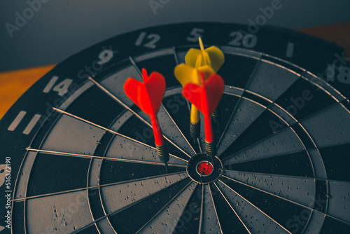 Bullseye is a target of business. Dart is an opportunity and Dartboard is the target and goal. So both of that represent a challenge in business marketing as concept. 