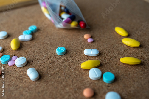 Pharmaceutical medicine pills in both tablets and capsules with the vintage retro picture style. Pharmacy theme and treatment medication as concept. 