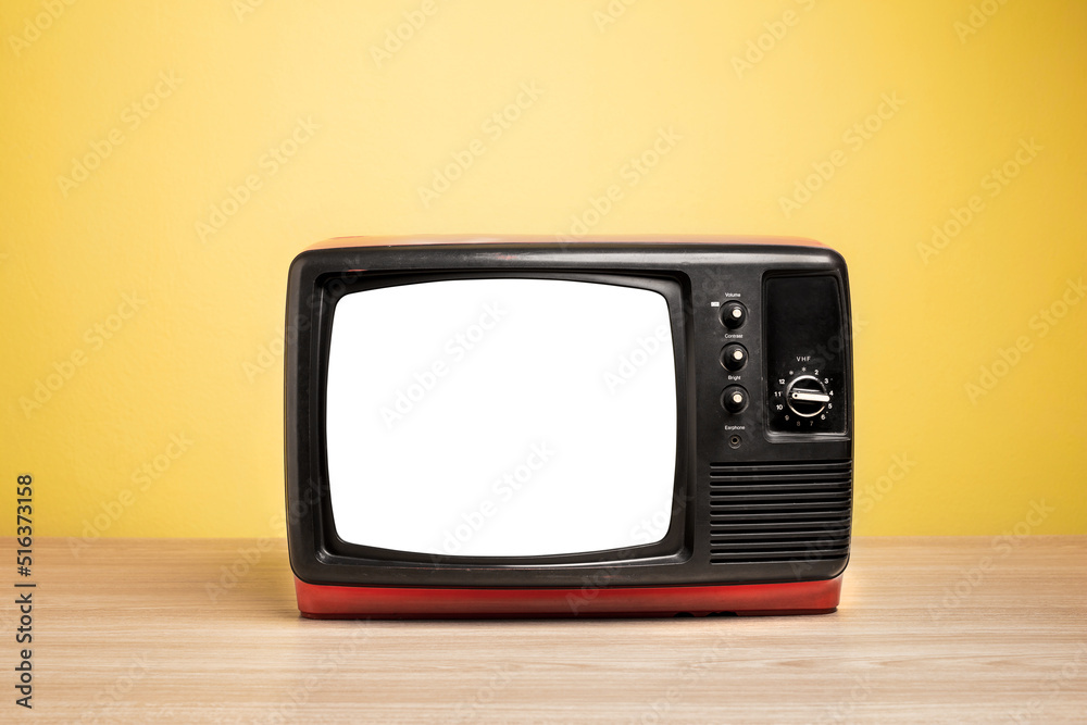 Retro old television cut out screen on wooden table with yellow background. Retro old television cut out screen on wooden table with yellow background.