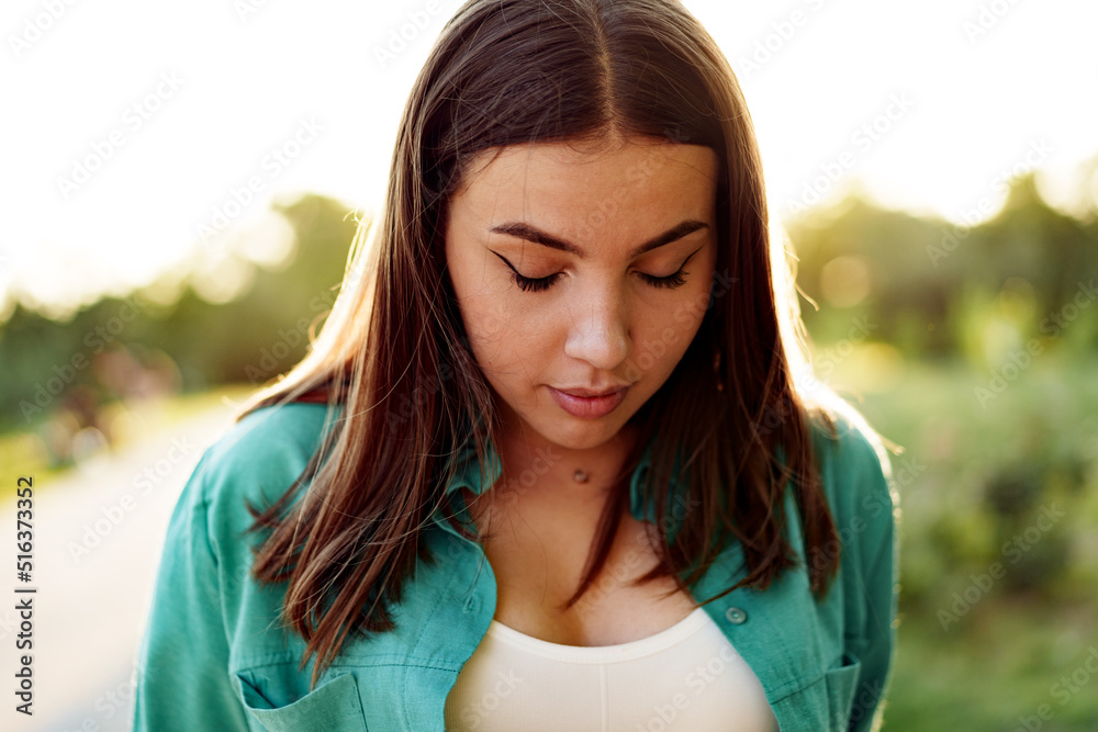 Close up portrait of a young smiling brunette woman Close up portrait of a young smiling brunette woman
