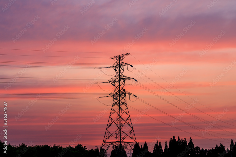High voltage electric tower at sunset. Transmission power line