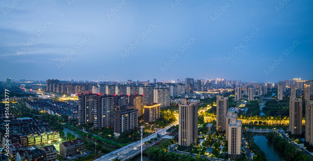 Aerial view of urban buildings residential area scenery in Jiaxing, China, Asia. Beautiful cityscape at sunset.