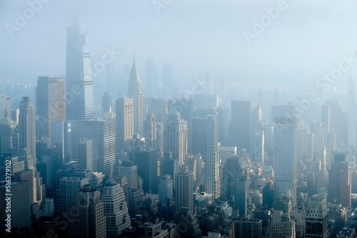 Photography Aerial shot of the skyscrapers of Manhattan in New York, USA on a foggy day