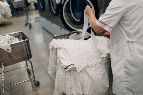 Dry cleaning clothes. Clean cloth chemical process. Laundry industrial dry-cleaning.