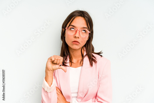Young hispanic woman isolated on blue background whining and crying disconsolately.
