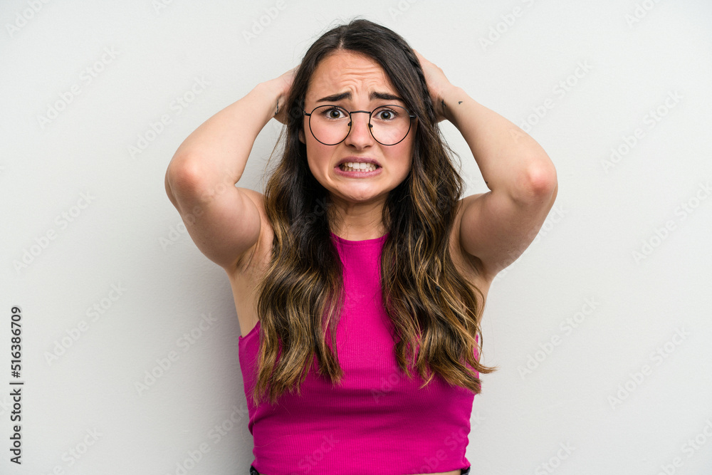Young caucasian woman isolated on white background screaming with rage.