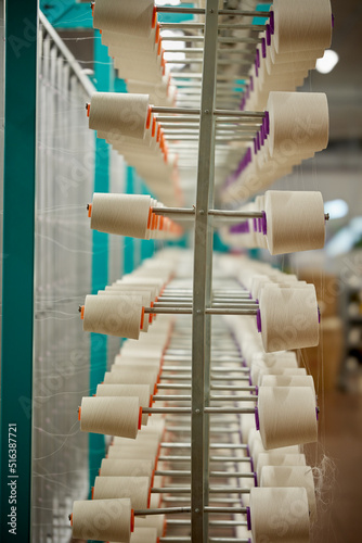 Industrial textile production line. Weaving looms in a textile factory