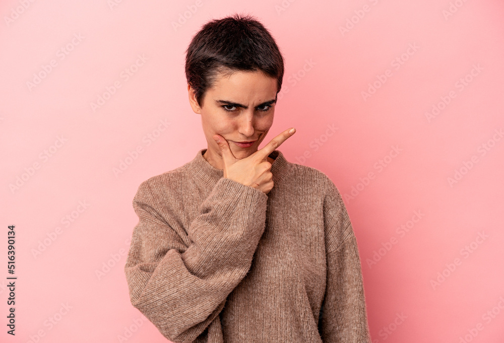 Young caucasian woman isolated on blue background contemplating, planning a strategy, thinking about the way of a business. Young caucasian woman isolated on blue background contemplating, planning a strategy, thinking about the way of a business.
