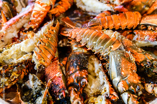 Prepared spiny lobsters on a plate. Exotic seafood © ihorbondarenko