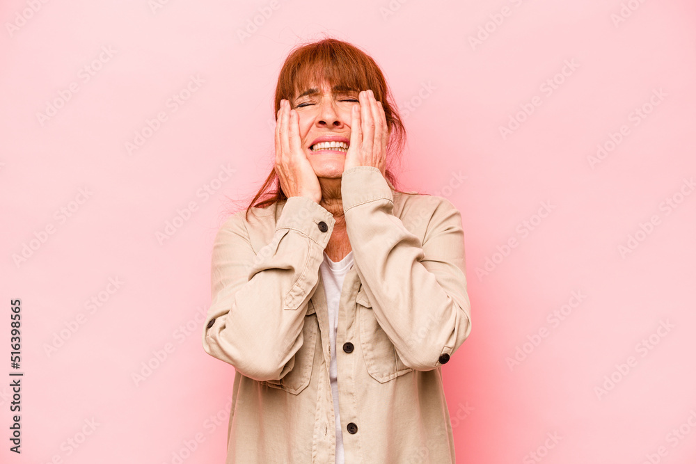 Middle age caucasian woman isolated on pink background whining and crying disconsolately. Middle age caucasian woman isolated on pink background whining and crying disconsolately.
