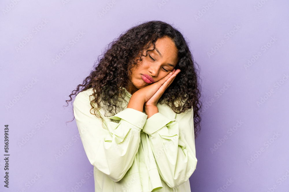 Young hispanic woman isolated on purple background yawning showing a tired gesture covering mouth with hand. Young hispanic woman isolated on purple background yawning showing a tired gesture covering mouth with hand.