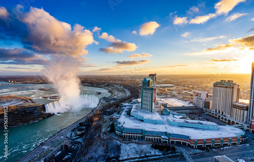 Obraz na płótnie Aerial view of Niagara Falls City downtown horizon and Horseshoe Falls in a winter sunny day sunset time