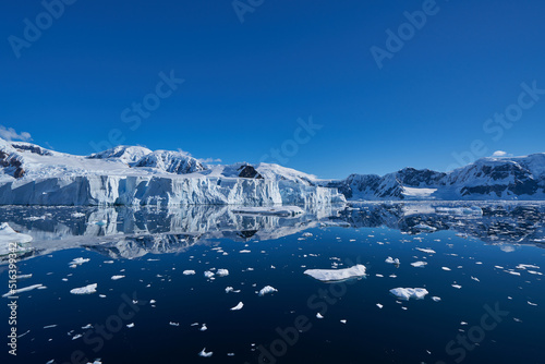 Antartic landscapes during a tripo across the Antartic peninsula with lot of icebergs, mountains and glaciers which land on the sea