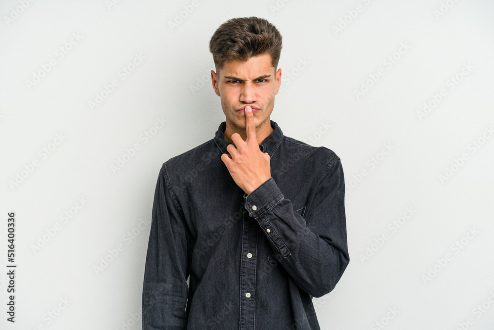 Young caucasian man isolated on white background thinking and looking up, being reflective, contemplating, having a fantasy. Young caucasian man isolated on white background thinking and looking up, being reflective, contemplating, having a fantasy.