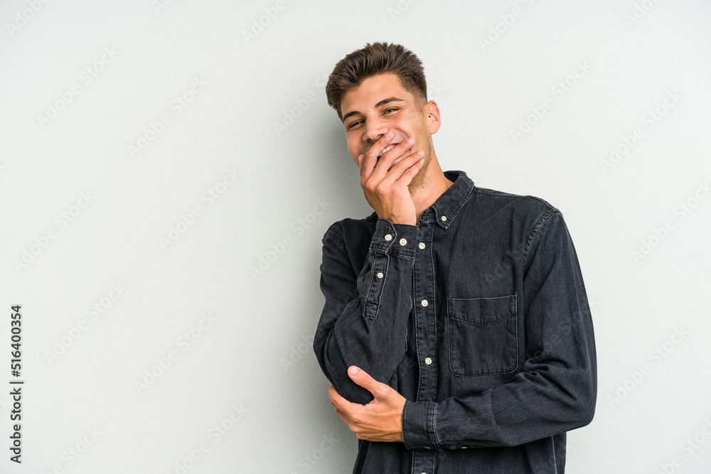 Young caucasian man isolated on white background laughing happy, carefree, natural emotion. Young caucasian man isolated on white background laughing happy, carefree, natural emotion.