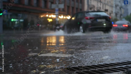 Shot of the asphalt of a city street with a river of water.